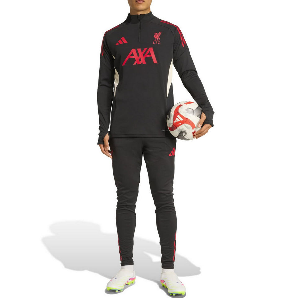 Adidas Liverpool training tracksuit 2025 in black with red accents worn by model holding a soccer ball