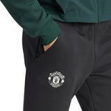 Adidas Man United pre-match suit featuring classic Manchester United logo and stylish design