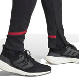 Adidas Man United pre-match suit featuring tapered pants and sleek design for soccer fans