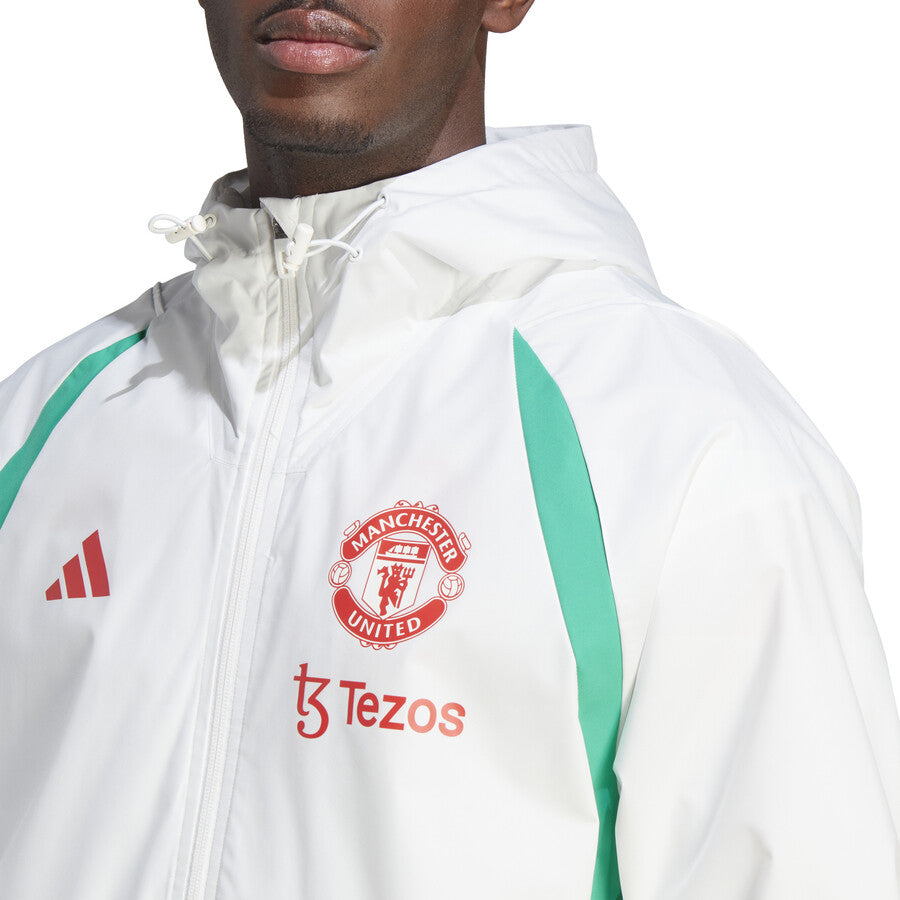 Adidas Manchester United 2023 24 rain jacket in white with green accents and team logo