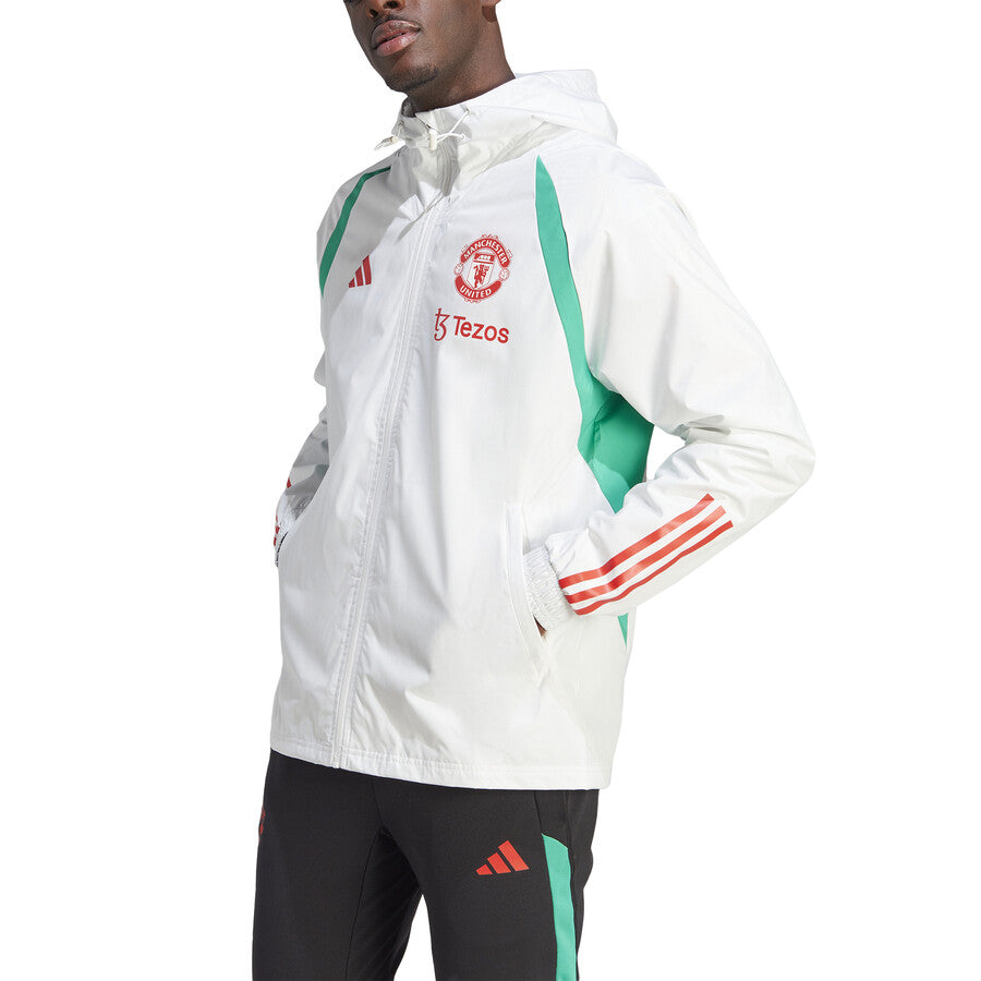Adidas Manchester United 2023 24 rain jacket in white with green accents, featuring team logo