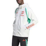 Adidas Manchester United 2023 24 rain jacket in white with green accents, featuring team logo