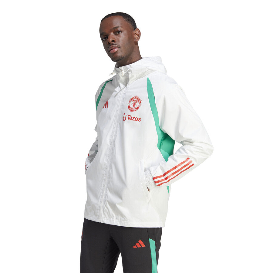 Adidas Manchester United 2023 24 rain jacket in white and green for soccer fans, featuring lightweight design