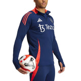 Manchester United 2024 training tracksuit in navy blue with red accents and sponsor logos