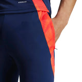 Close-up of navy and red Manchester United 2024 training tracksuit pants with Aeroready fabric