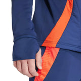 Close-up of sleeve and waistband featuring orange detail on Manchester United 2024 training tracksuit on SoccerTracksuits.com