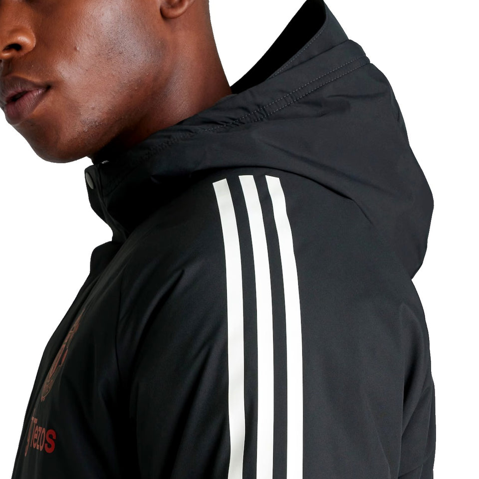 Adidas Manchester United black parka 2024 25 featuring a sleek design with iconic stripes and hood