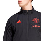 Adidas Manchester United presentation tracksuit 2023 24 in black featuring logo and zip pockets