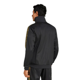 Back view of man wearing black Mexico Gold Cup Adidas tracksuit 2025 with gold patterned side stripes and high collar