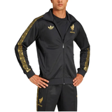 Male model wearing Mexico Gold Cup Adidas tracksuit 2025 black jacket and pants with gold eagle and patterned sleeve stripes