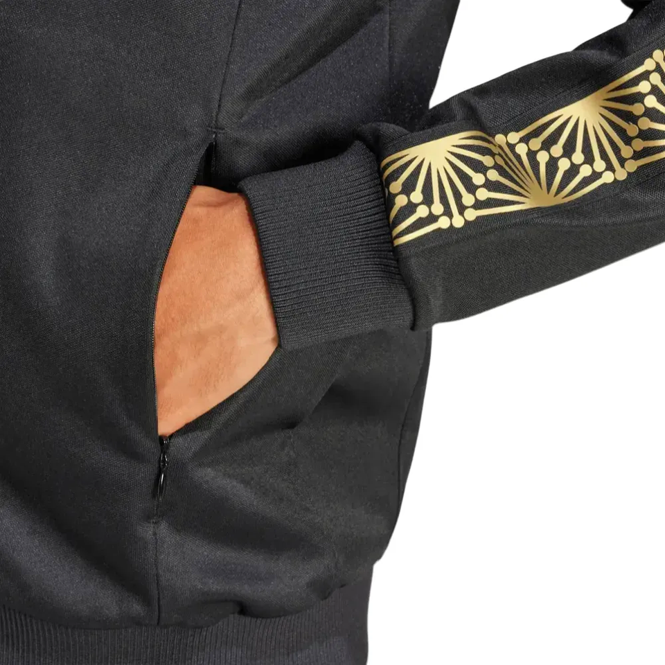 Close up of Soccer Tracksuits black jacket with hand in zip pocket gold sleeve print Mexico Gold Cup Adidas tracksuit 2025