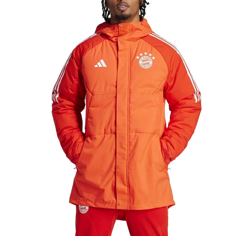 Men wearing official Bayern Munich Adidas parka in bright orange with hood and logo details