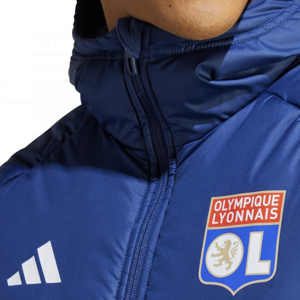 Close-up of blue Olympique Lyon winter jacket with club logo and Adidas branding on SoccerTracksuits.com