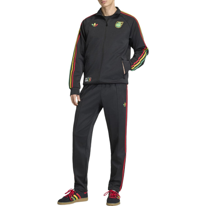 Black tracksuit from Adidas with red, yellow, and green stripes and logo