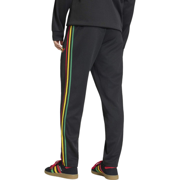 Black track pants with multicolored stripes along the sides in a slim fit style