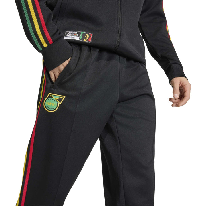 Black track pants with red, yellow, and green stripes and Jamaica emblem