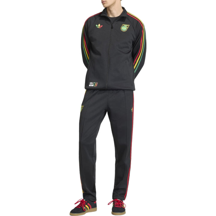 Black Adidas tracksuit with red and green stripes and logo