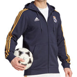 Adidas Real Madrid hooded soccer tracksuit displayed with a player holding a soccer ball