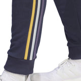 Detail of Adidas Real Madrid hooded soccer tracksuit highlighting stylish stripes on the pants