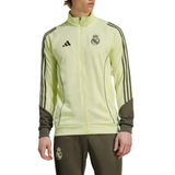 Adidas Real Madrid tracksuit 2025 in bright yellow with logo and contrasting dark pants