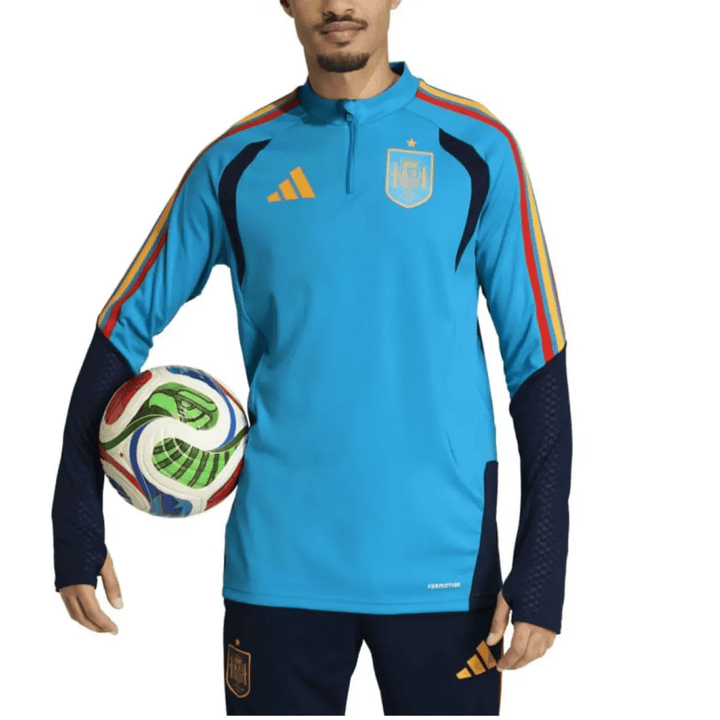 Spain training technical soccer tracksuit 2026/27 by Adidas in blue with red and yellow accents, includes matching pants set.