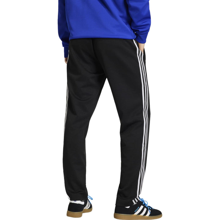 Black Adidas track pants with white stripes and elastic waistband