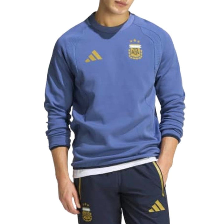 Blue Adidas sweatshirt with gold logo and accents, featuring a crew neck design.