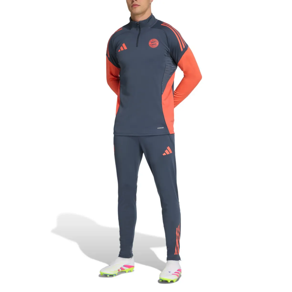 Bayern Munich grey training tracksuit 2025 with contrasting orange accents on SoccerTracksuits.com