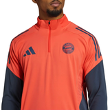 Bayern Munich training tracksuit 2025 26 in vibrant orange with navy stripes and adidas logo