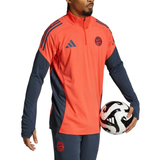 Bayern Munich training tracksuit 2025 26 in vibrant orange and navy with zip collar, perfect for soccer practice