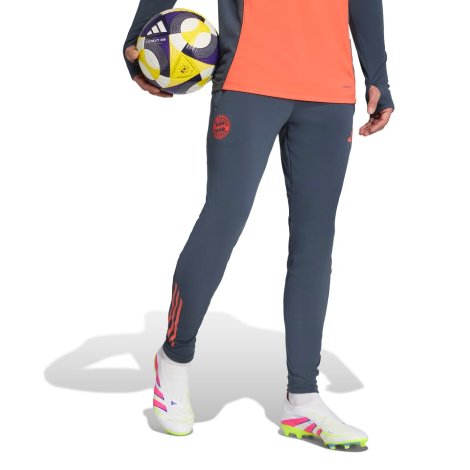 Bayern Munich training tracksuit 2025 26 in orange and navy with tapered pants for soccer training