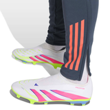 Close-up of Adidas Bayern Munich training tracksuit 2025 26 pants and sleek soccer cleats for athletes