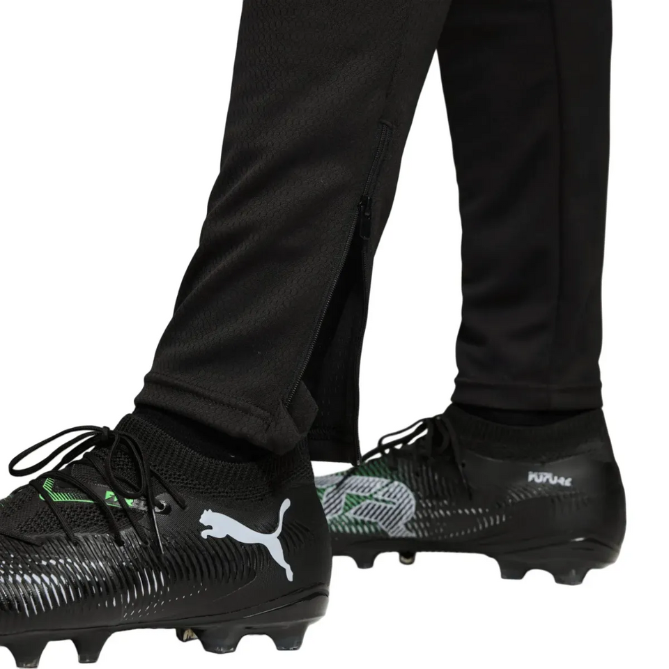 Close-up of Borussia Dortmund UCL tracksuit 2025 26 with black pants and detailed Puma cleats