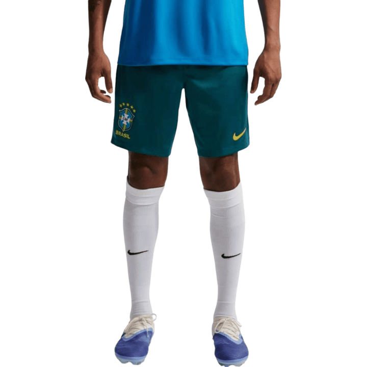Men's green Nike soccer shorts with Brazil logo and yellow accents