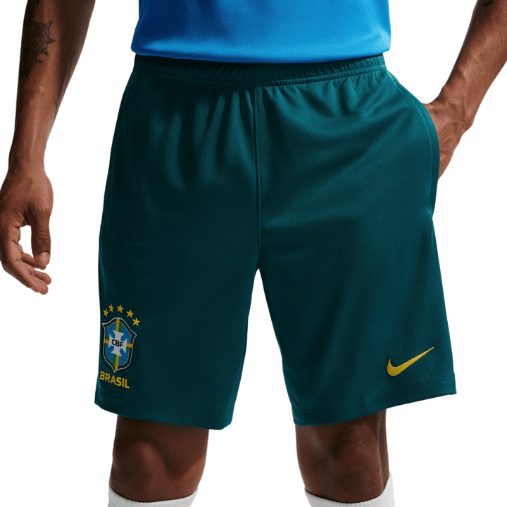 Men's teal soccer shorts made of breathable fabric with Brazil national team logo and Nike swoosh