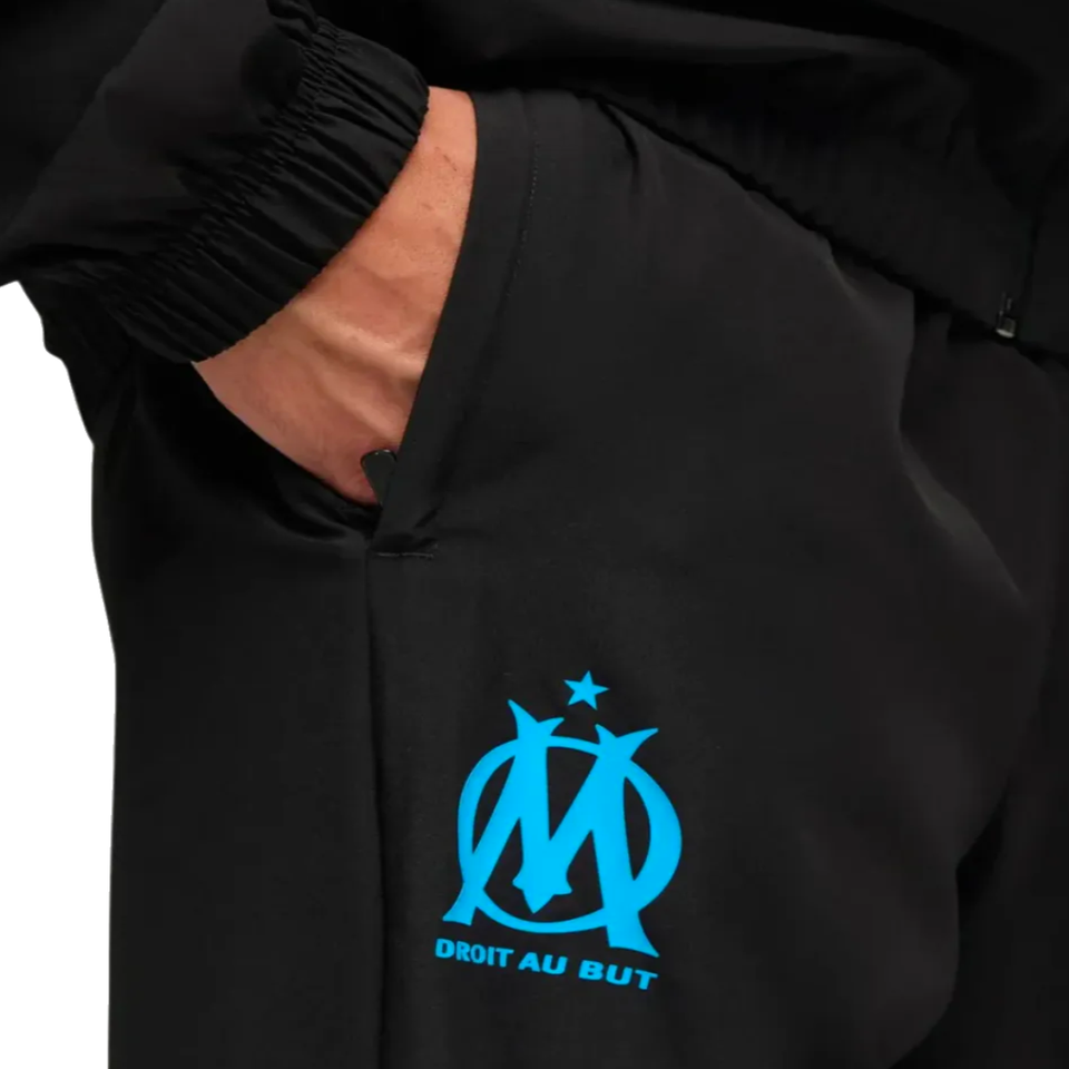 Close-up of Olympique Marseille tracksuit pocket with logo, perfect to buy Olympique Marseille tracksuit online