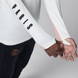 Close-up of PSG Jordan kids tracksuit with Paris lettering on sleeves, ideal to buy PSG Jordan kids tracksuit online