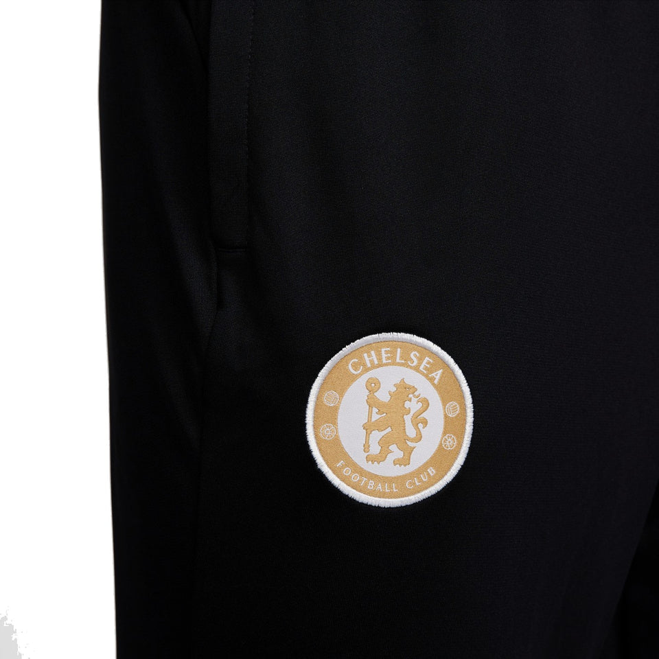 Close-up of Chelsea FC training tracksuit 2023 2024 logo on leg for fans and athletes