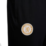 Close-up of Chelsea FC training tracksuit 2023 2024 logo on leg for fans and athletes