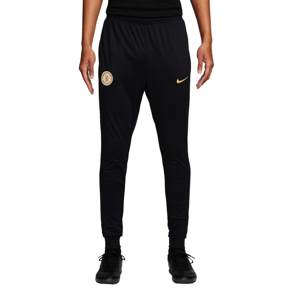 Chelsea FC training tracksuit 2023 2024 featuring black pants with logo and Nike branding for athletes