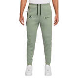 Official Chelsea Nike Tech fleece set featuring tapered joggers with team logo on SoccerTracksuits.com