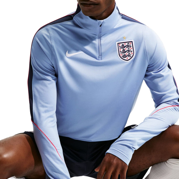 England training technical soccer tracksuit 2026/27 in light blue, featuring Nike branding and official emblem, set for adults.