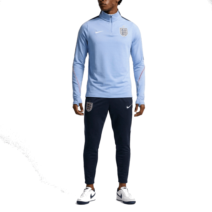 England training technical soccer tracksuit 2026/27 in light blue and navy with Nike logo and team badge