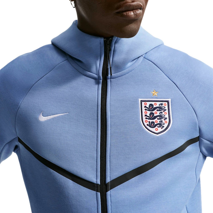 Light blue Nike zip-up jacket with England football crest and black stripe detail