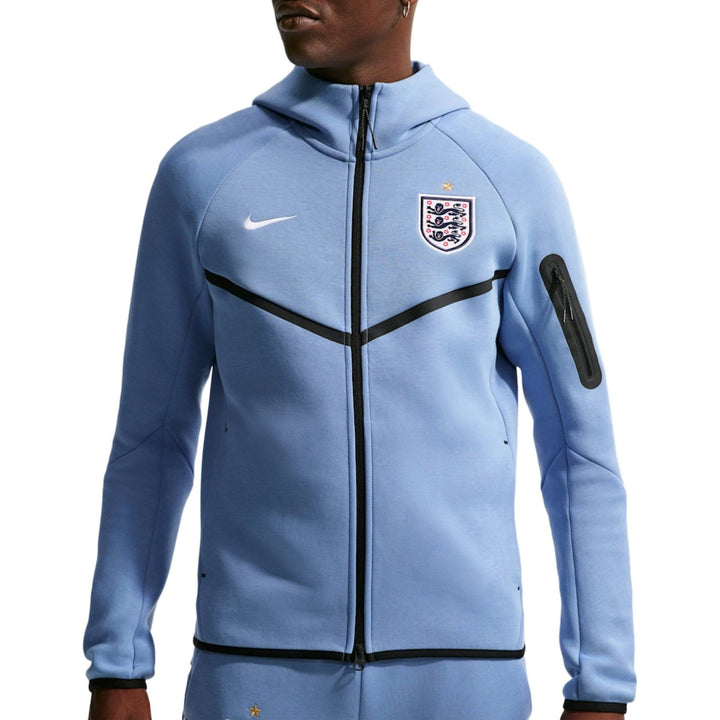 Light blue Nike zip-up jacket with black accents and England football crest