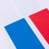 Close-up of Faroe Islands 2024 soccer jersey detail featuring blue and red stripes on white fabric