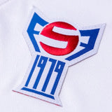Close-up of embroidered badge on Faroe Islands 2024 soccer jersey on SoccerTracksuits.com
