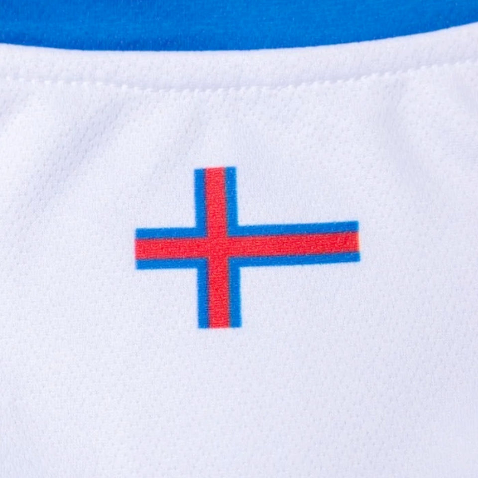 Close-up of Faroe Islands 2024 soccer jersey featuring red and blue cross emblem