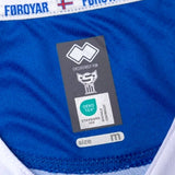 Faroe Islands away soccer jersey 2024 label showing fabric information and size M for quality assurance