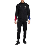 FC Barcelona black tracksuit 2024 25 featuring a zip-up jacket and matching pants in black with team colors